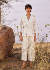 A Model Wearing White Cotton Mul Ruyi co ord set curated by Only Ethikal