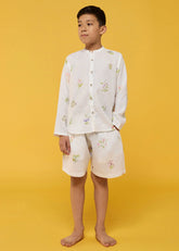 A Model Wearing White Linen Kids Akio Floral Linen Shirt- White, curated by Only Ethikal