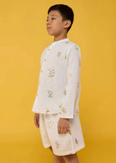 A Model Wearing White Linen Kids Akio Floral Linen Co-Ord Set- White, curated by Only Ethikal