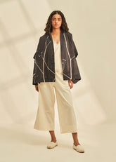 A Model Wearing Black Cotton Mul Eclipse Cape , curated by Only Ethikal