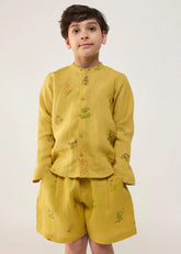 A Model Wearing Yellow Linen Kids Kimi Timeless Linen Shorts- Ochre, curated by Only Ethikal