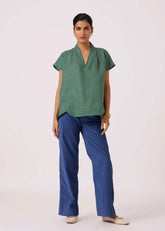 A Model Wearing Green Linen Orion Green Linen Top, curated by Only Ethikal