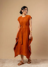 A Model Wearing Orange Organic Cotton Bessie Knot Dress, curated by Only Ethikal