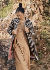 A Model Wearing Black Warm sandwich fabric Illusion Reversable Jacket curated by Only Ethikal