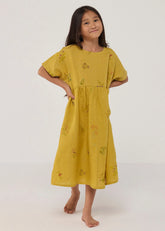 A Model Wearing Yellow Linen Kids Rasa Floral Printed Linen Dress- Ochre, curated by Only Ethikal