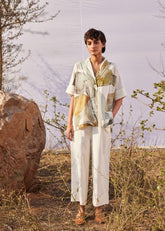 A Model Wearing White Cotton Mul Verdure Twill Pants,curated by Only Ethikal
