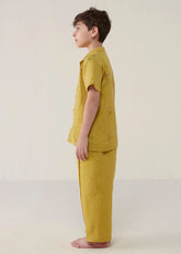 A Model Wearing Yellow Linen Kids Neo Timeless Linen Pants- Ochre, curated by Only Ethikal