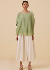 A Model Wearing Green Cotton silk Kosh Green Cape Top , curated by Only Ethikal