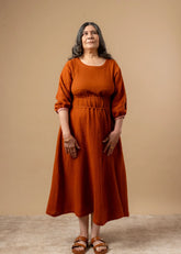 A Model Wearing Orange Organic Cotton Meadowmallow Dress, curated by Only Ethikal