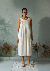 A Model Wearing White Pure Cotton Coconut Sips Dress, curated by Only Ethikal