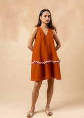 A Model Wearing Orange Organic Cotton Daisy Daze Dress, curated by Only Ethikal