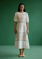 A Model Wearing Ivory Linen Sehr Metallic Linen Piping Dress- Ivory, curated by Only Ethikal