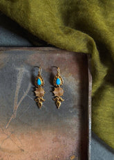 A Model Wearing Gold 18k Gold plated over brass Turquoise Na-Gyen Akor Earrings, curated by Only Ethikal