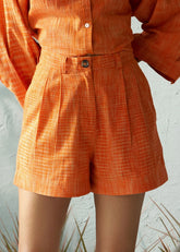 A Model Wearing Orange Pure Cotton Canary Drift Shorts, curated by Only Ethikal