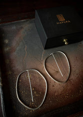 A Model Wearing Silver Pure Silver Silver Na-Gyen Tongpa Nyi Earrings, curated by Only Ethikal