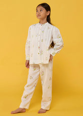 A Model Wearing White Linen Kids Akavi Pleated Floral Linen Co-Ord Set- White, curated by Only Ethikal
