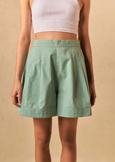 A Model Wearing Green Organic Cotton The Ocean Tide organic cotton shorts, curated by Only Ethikal