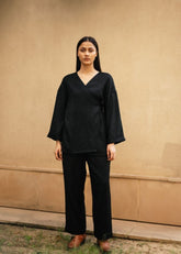 A Model Wearing Black Wool Pansy Top- Black , curated by Only Ethikal