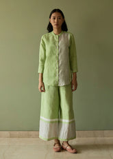 A Model Wearing Green Linen Aline Mandarin Collar Border Linen Shirt- Meadow, curated by Only Ethikal