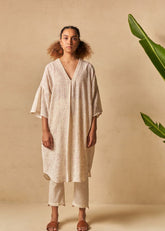 A Model Wearing Beige Organic Cotton The Holiday handwoven kaftan, curated by Only Ethikal