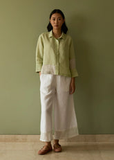A Model Wearing Green Linen Tia Stripe Linen Cropped Shirt- Meadow, curated by Only Ethikal