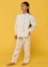 A Model Wearing White Linen Kids Akavi Pleated Floral Linen Shirt- White, curated by Only Ethikal