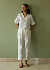A Model Wearing White Linen Kiera Cuban Collar Linen Shirt- Ivory, curated by Only Ethikal
