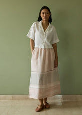 A Model Wearing Pink Linen Ora Pleated Border Linen Skirt- Blush, curated by Only Ethikal
