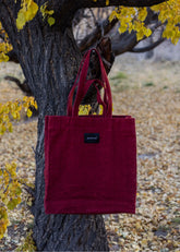 A Model Wearing Red Cotton Canvas Red Bakhor Appliqué Canvas Tote, curated by Only Ethikal