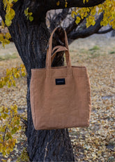 A Model Wearing Beige Cotton Canvas Beige Bakhor Appliqué Canvas Tote, curated by Only Ethikal