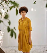 A Model Wearing Yellow Pure Cotton Love Burns Dress curated by Only Ethikal