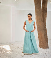 A Model Wearing Blue Linen Morning SkyJumpsuit,curated by Only Ethikal