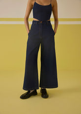 A Model Wearing Organic Cotton Denim The Daisy Denim Trousers, curated by Only Ethikal