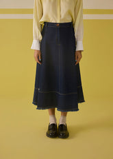 A Model Wearing Organic Cotton Denim The Sunshine Denim Skirt, curated by Only Ethikal
