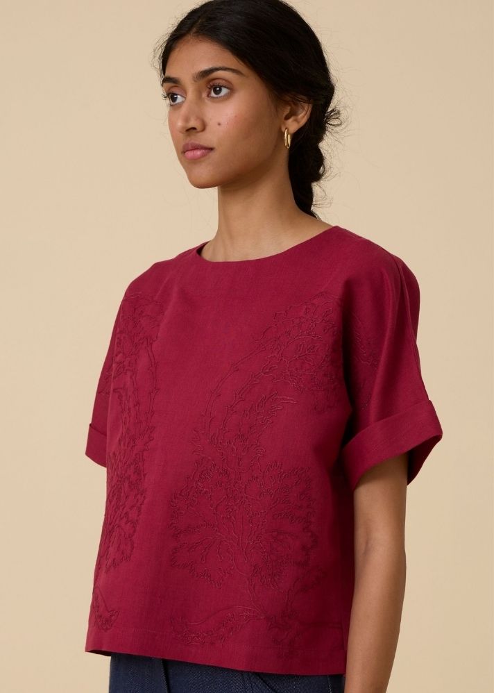 A Model Wearing Red Linen Affan Cherry Embroidered Top , curated by Only Ethikal