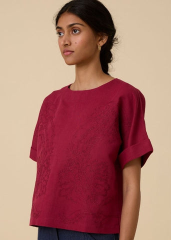 A Model Wearing Red Linen Affan Cherry Embroidered Top , curated by Only Ethikal