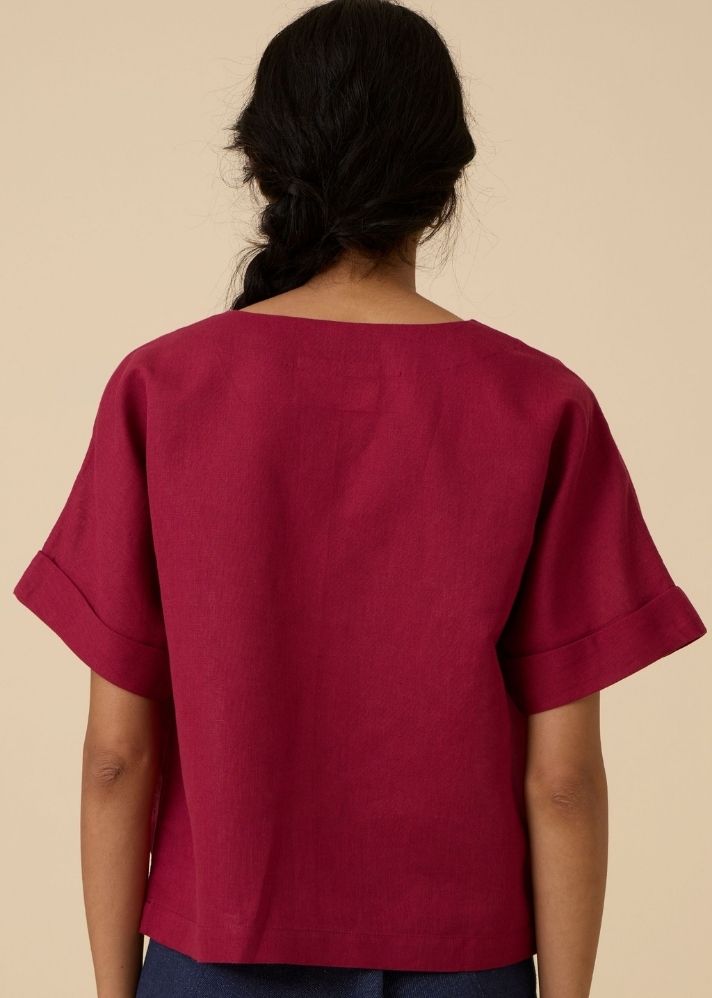 A Model Wearing Red Linen Affan Cherry Embroidered Top , curated by Only Ethikal