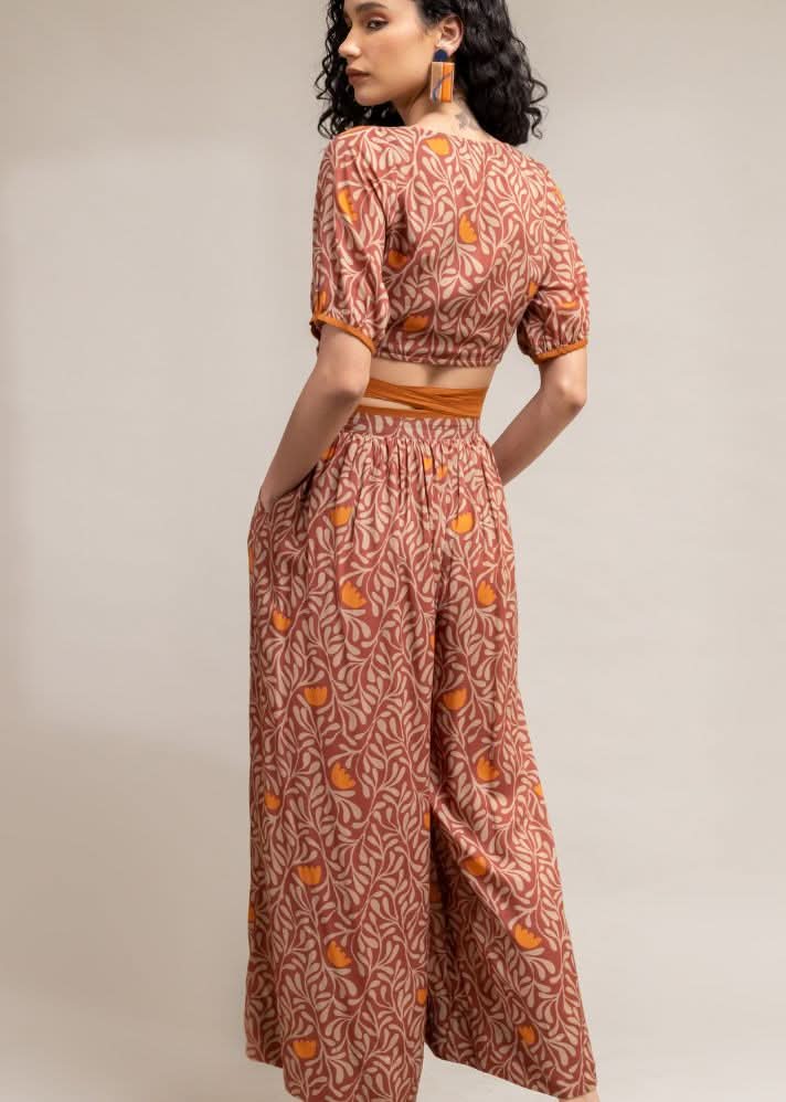A Model Wearing Brown Upcycled Cotton  Rehno Printed Trousers, curated by Only Ethikal