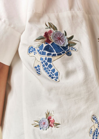 A Model Wearing White Organic Cotton Wild Ocean Heart organic cotton shirt, curated by Only Ethikal