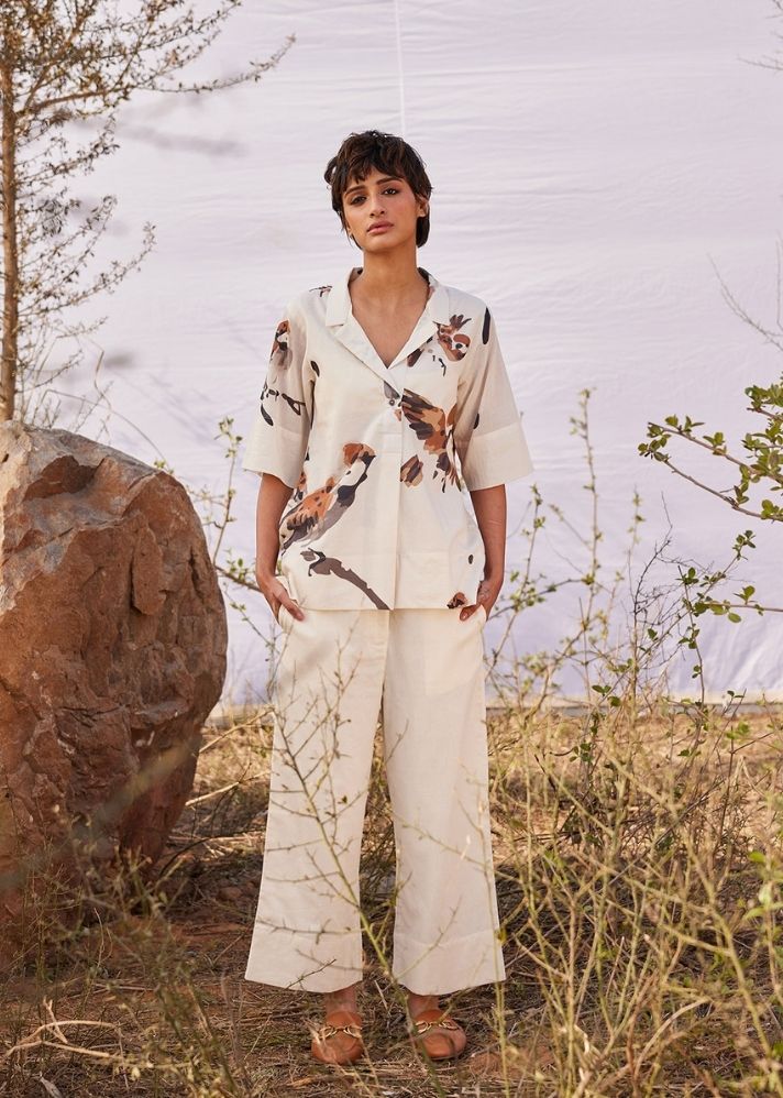 A Model Wearing White Cotton Mul Chidiya co ord set curated by Only Ethikal