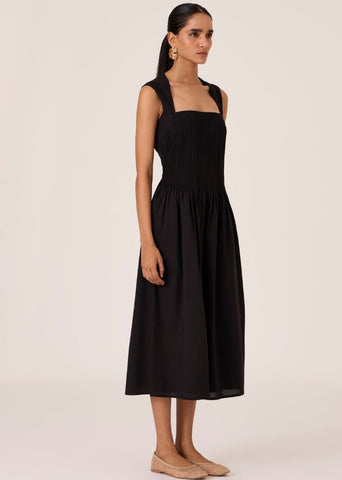 A Model Wearing Black Organic Cotton Ziva Black Pleated Midi Dress , curated by Only Ethikal