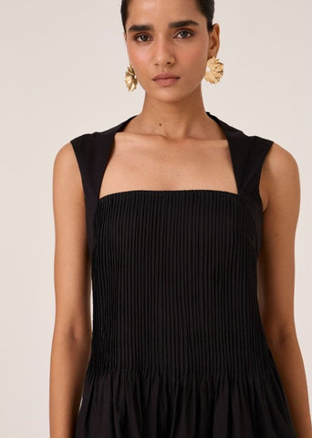 A Model Wearing Black Organic Cotton Ziva Black Pleated Midi Dress , curated by Only Ethikal
