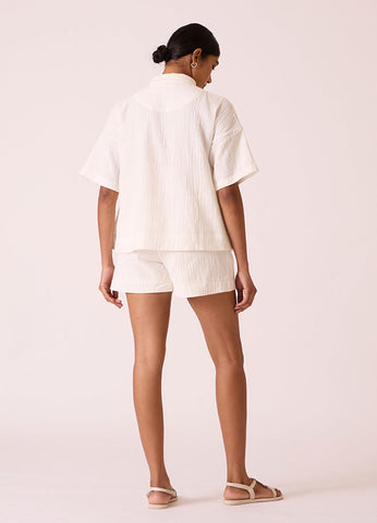 A Model Wearing White Organic Cotton Dora Crinkle Cotton Shorts , curated by Only Ethikal