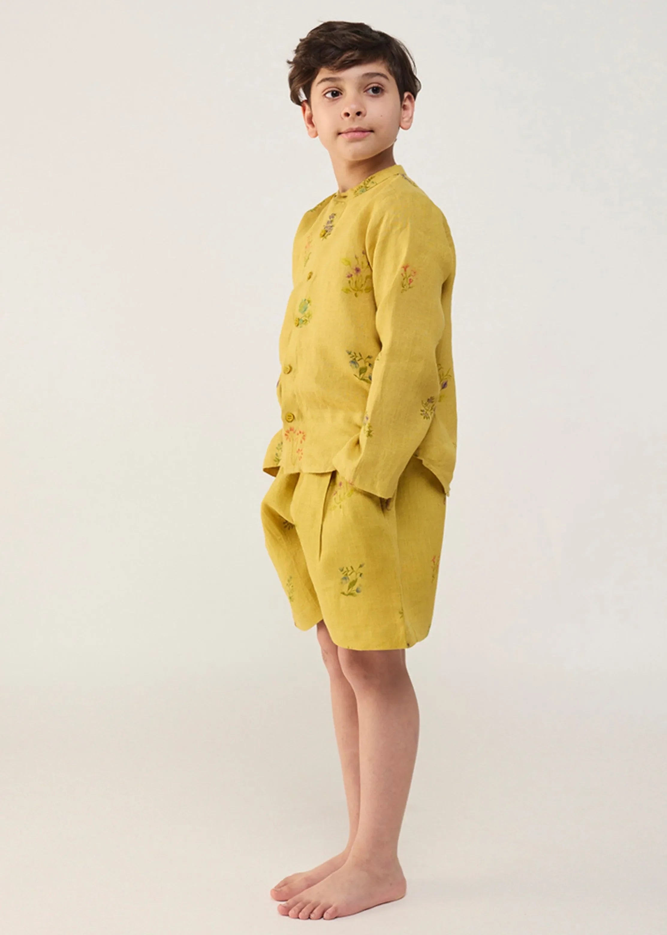 A Model Wearing Yellow Linen Kids Akio Floral Linen Shirt- Ochre, curated by Only Ethikal
