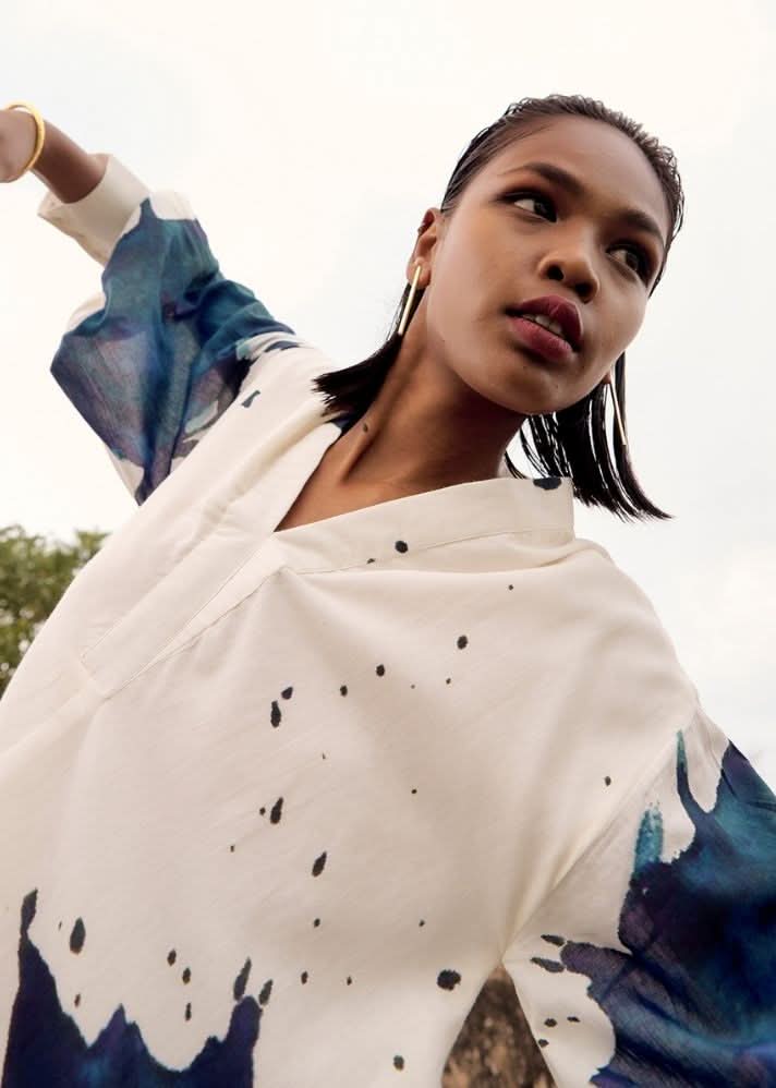 A Model Wearing White Pure Cotton Pomarine Dress curated by Only Ethikal