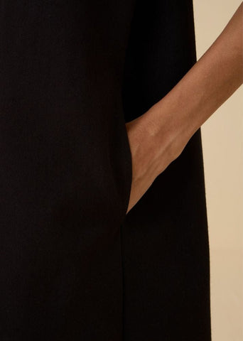 A Model Wearing Black Wool Cotton Ehan Black Hand Applique Dress , curated by Only Ethikal