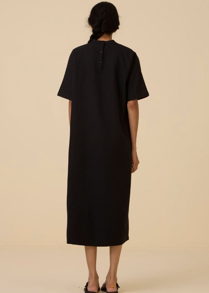 A Model Wearing Black Wool Cotton Ehan Black Hand Applique Dress , curated by Only Ethikal