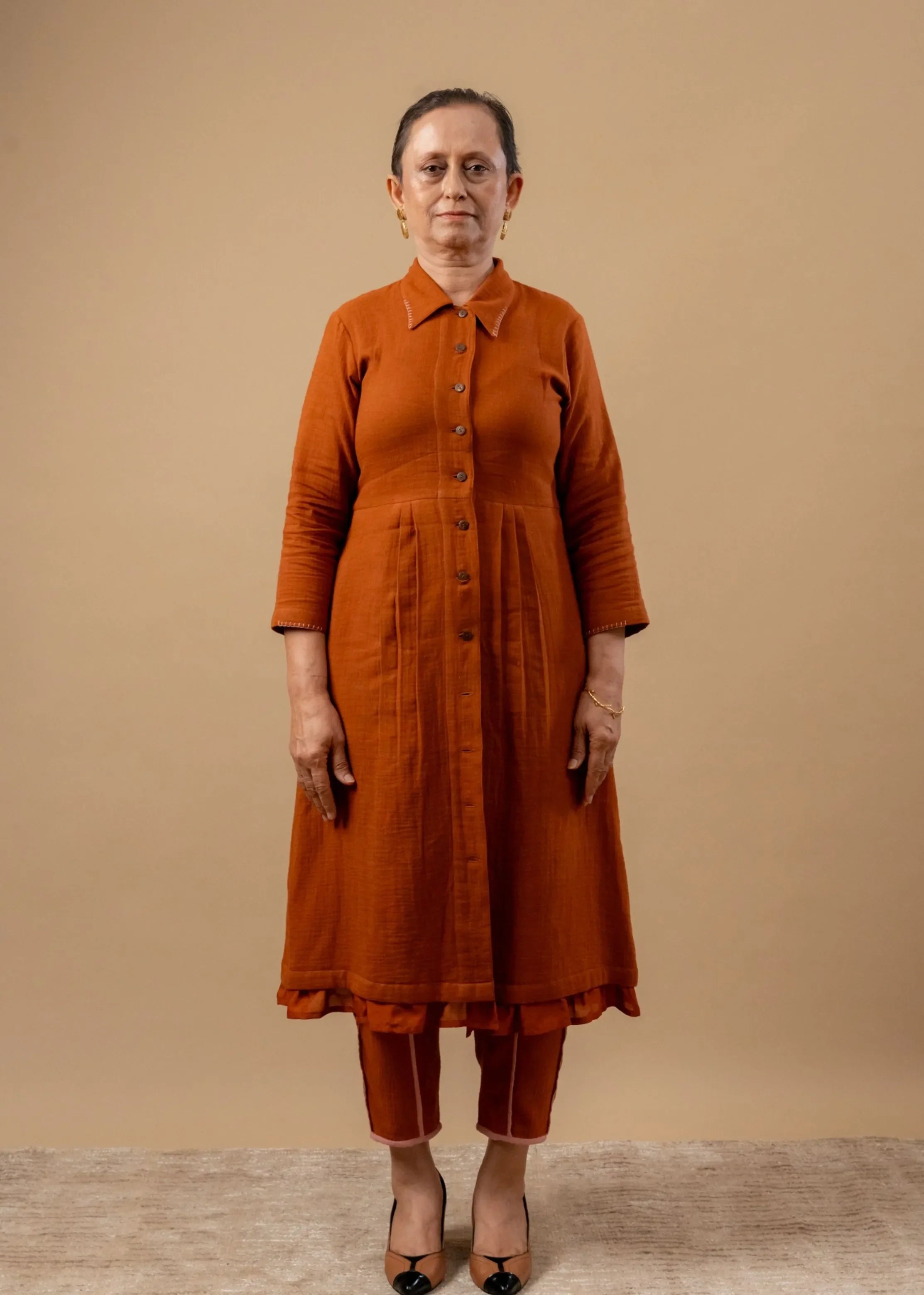 A Model Wearing Orange Organic Cotton Carolle Set, curated by Only Ethikal