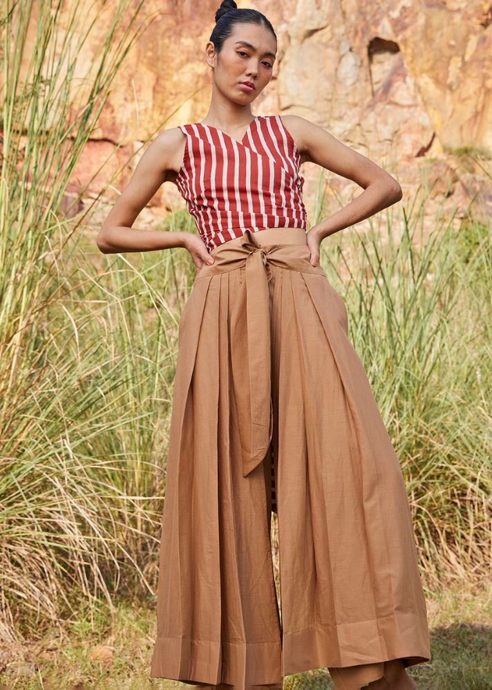 A Model Wearing Brown Pure Cotton Lost In Chase Pleated Trouser curated by Only Ethikal