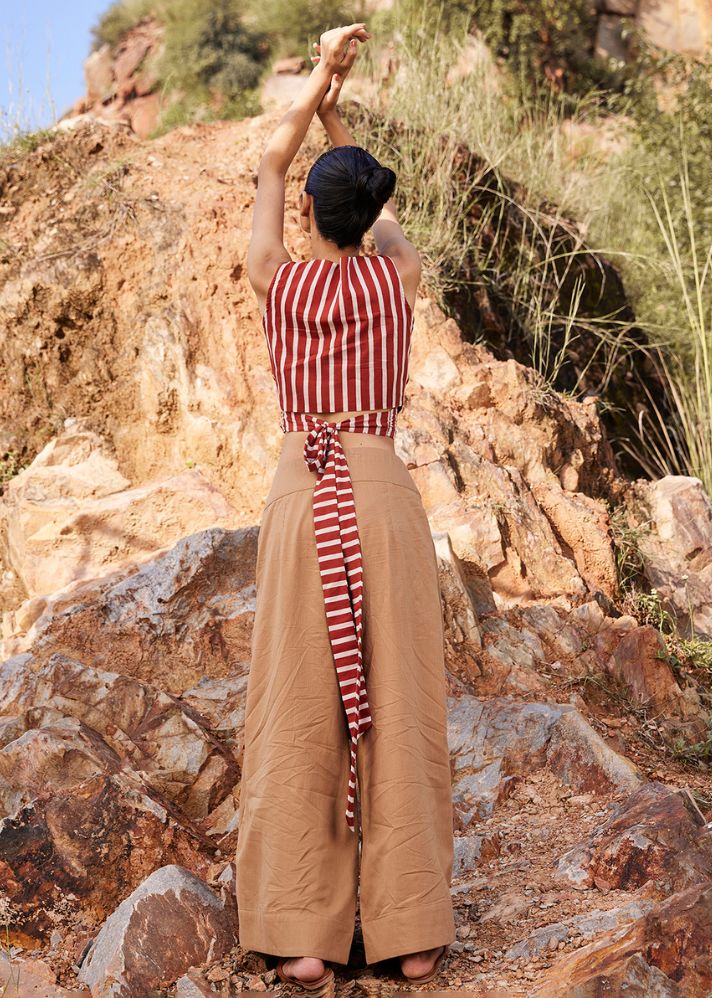 A Model Wearing Brown Pure Cotton Lost In Chase Pleated Trouser curated by Only Ethikal